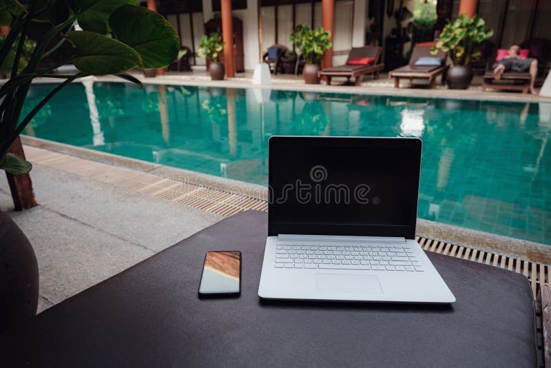 Laptop at the Swimming Pool and Smartphone Stock Image Image of