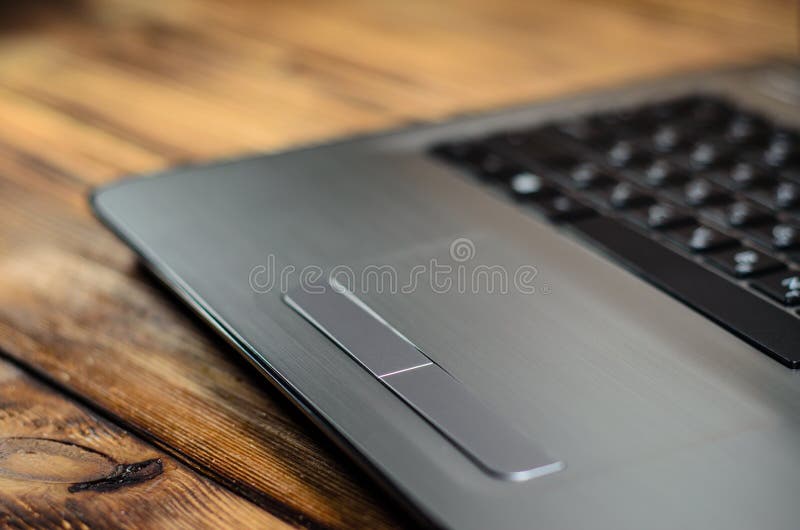 Laptop on wooden table stock image. Image of notepad 91905041
