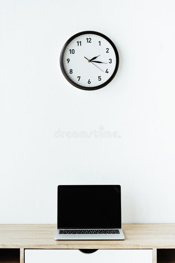 Laptop on Work Desk Under Clock Hanging Stock Photo Image of clock