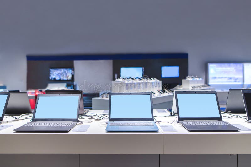 Laptops in the modern electronics store. Computer department in the technology store stock image