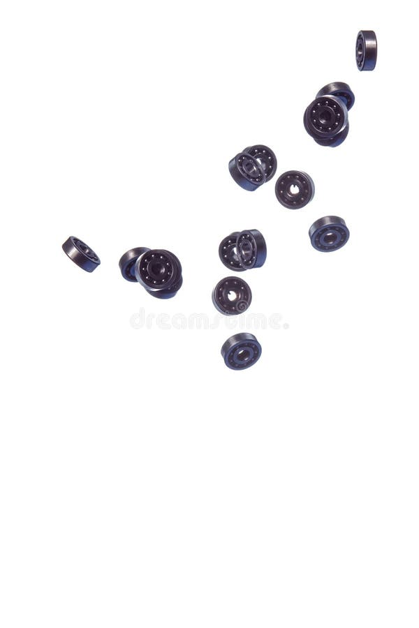 Large Amount of Ball Bearings Falling in Bulk Isolated Over White