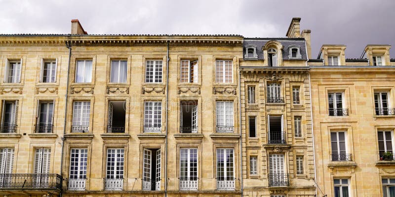 Large ancient building facade typical of Bordeaux city center royalty free stock photo