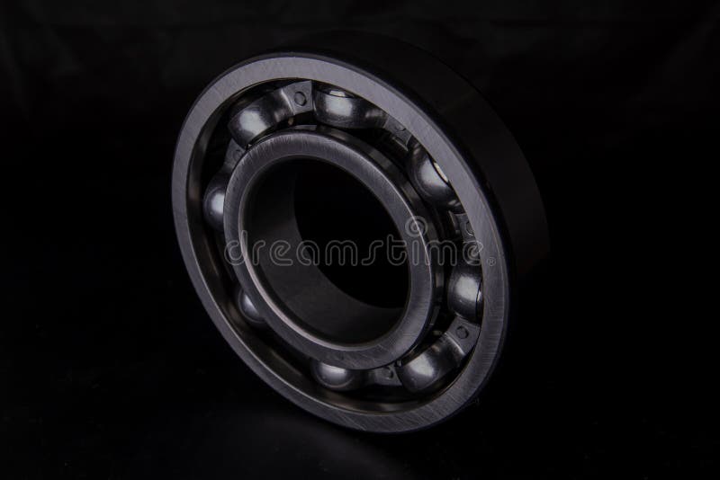 A Large Bearing in a Hand on a Dark Background Stock Image Image of