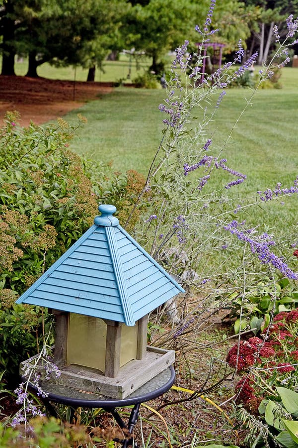 Large Bird Feeder in Garden royalty free stock photography