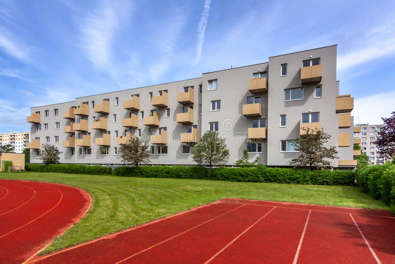 A large brick building with a athletic track royalty free stock photography