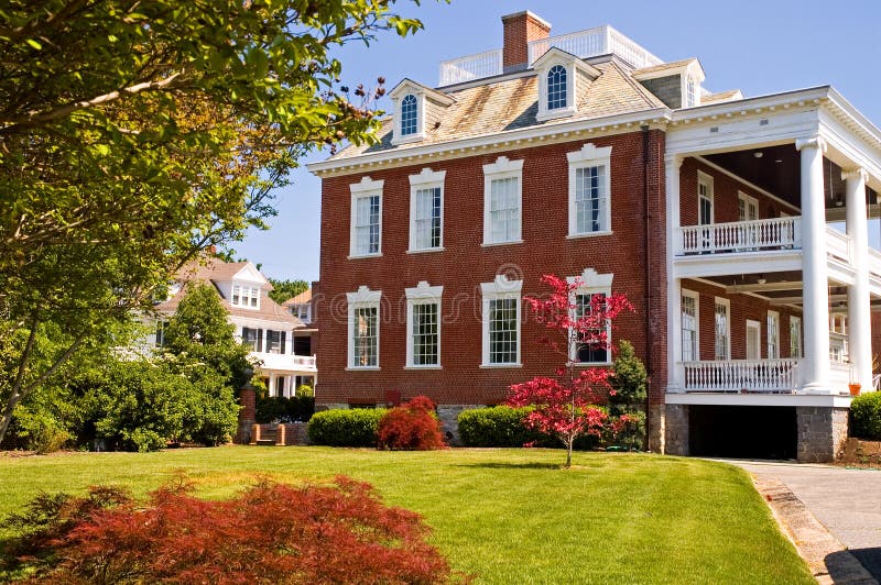 Large brick mansion with porch stock photo Large brick mansion with porch stock photo