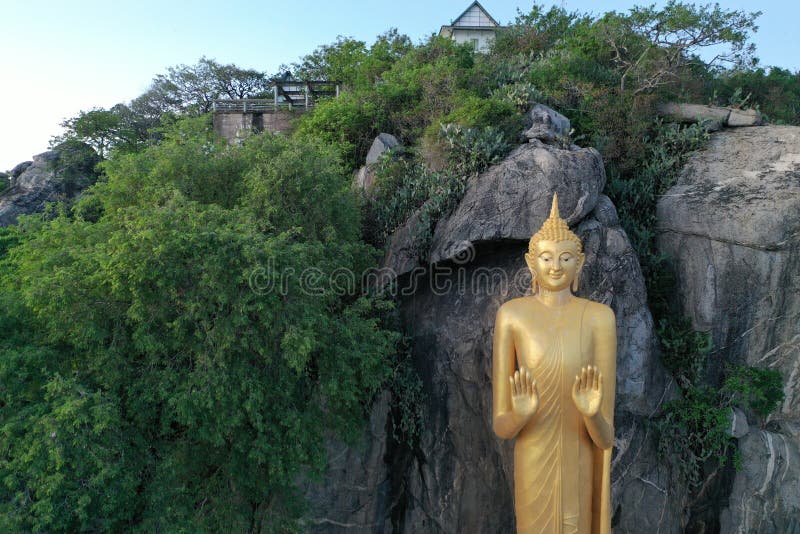 Buddhist Statue Rests Above the Mountain in Ratchaburi Thailand Stock