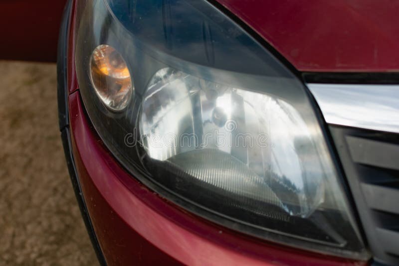 Large car headlights close-up, technical road lighting day and night.