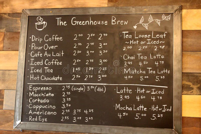Large black board on wall of cafe, with coffee items listed for guests perusal, The Greenhouse Brew, Sherrill, New York, 2018 stock photography Large black board on wall of cafe, with coffee items listed for guests perusal, The Greenhouse Brew, Sherrill, New York, 2018 stock photography