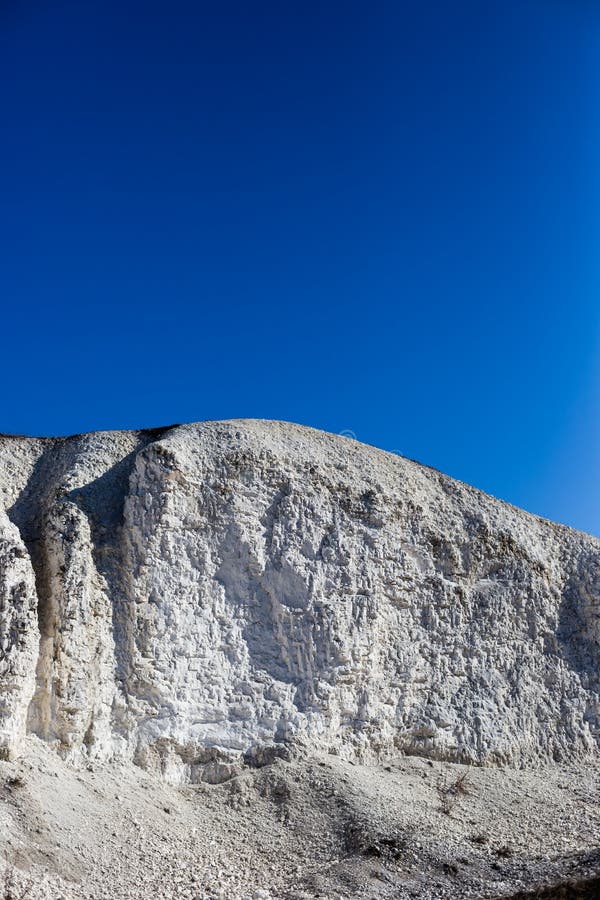 Large Chalky Mountain and Blue Sky without Clouds Stock Photo Image
