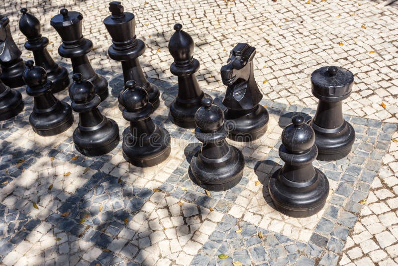 Small Female Figure Surrounded By Huge Chess Pieces Within An Ornate Old  Building Stock Photo - Download Image Now - iStock