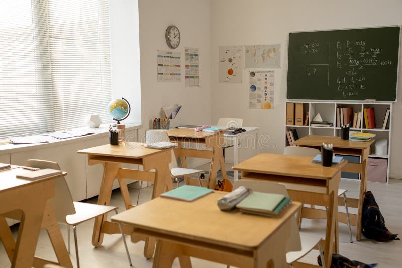 Large classroom in contemporary school with rows of desks stock photos