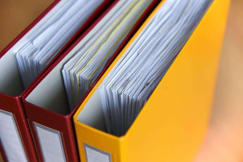 Large color folders for documents on the table in the office, close-up, copy space