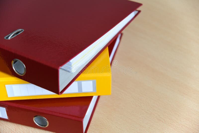 Large color folders for documents on the table in the office, close-up, copy space