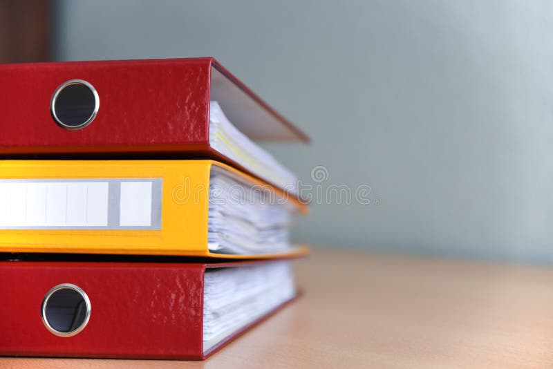 Large color folders for documents on the table in the office, close-up, copy space