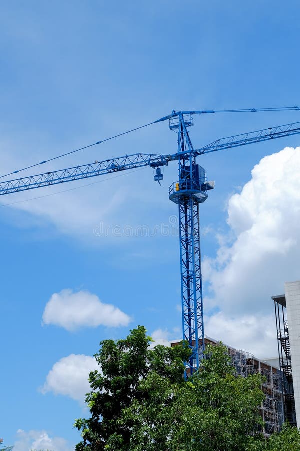 Large Construction Crane Machine With Clear Blue Sky Stock Image