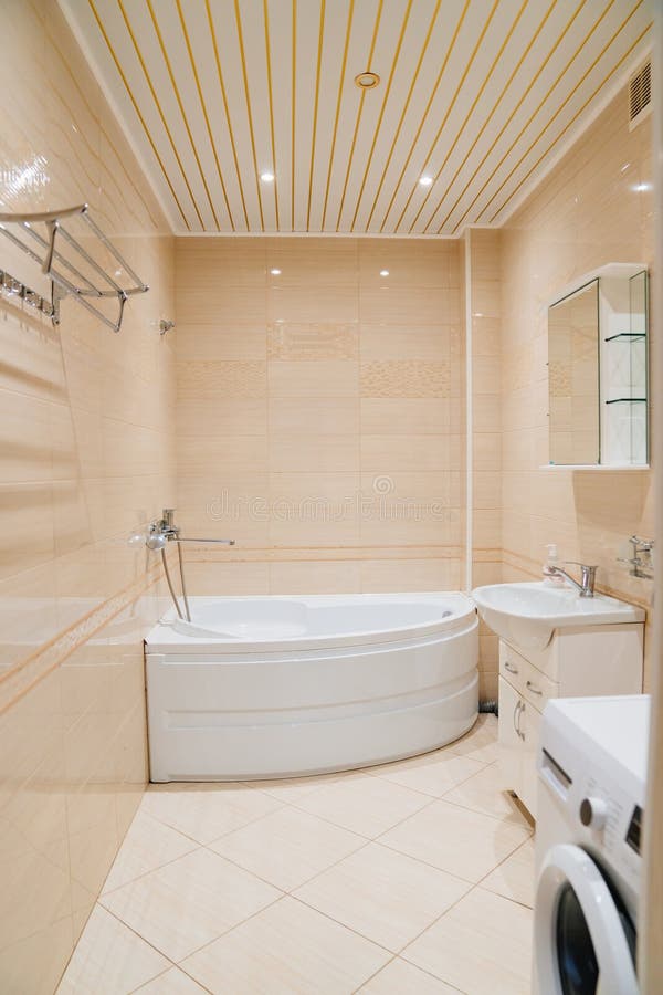 Large corner bath in a spacious bathroom stock image