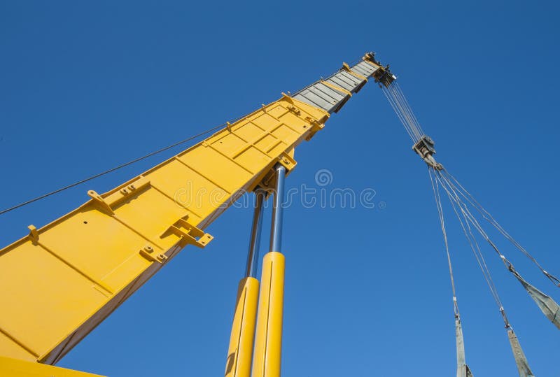 Large crane jib against blue sky background