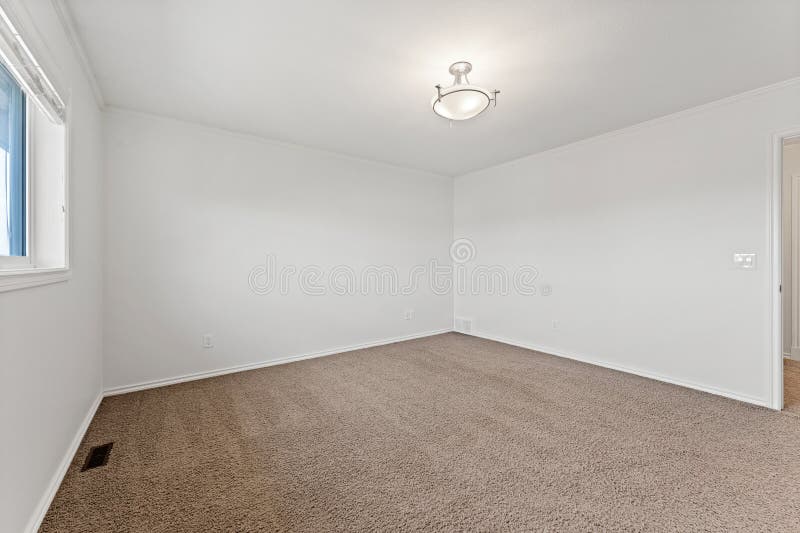 Large empty room with a white ceiling and white walls royalty free stock images