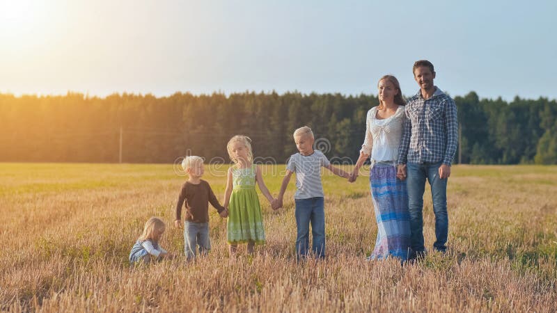 A Large Family is Lined Up and Poses in Front of the Camera. Stock Photo -  Image of male, people: 164606440