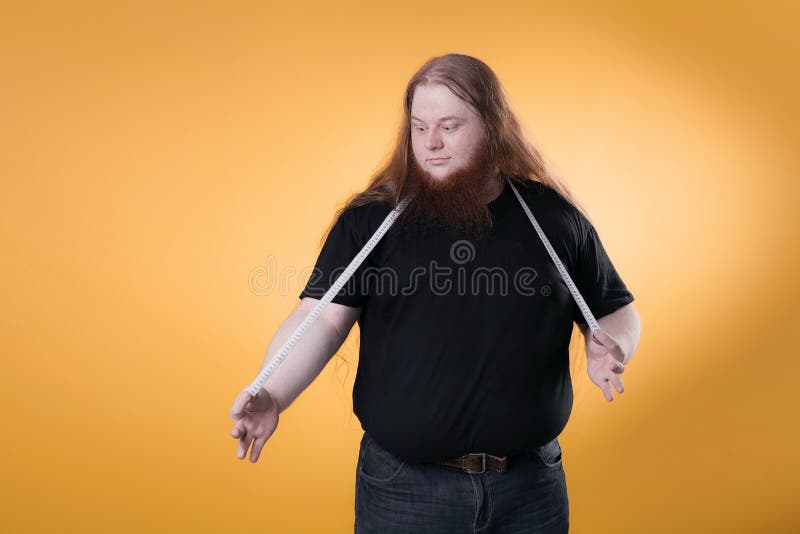 A Large Fat Man Measures His Large Sizes with a Ribbon. Stock Image - Image  of weak, adult: 127683337