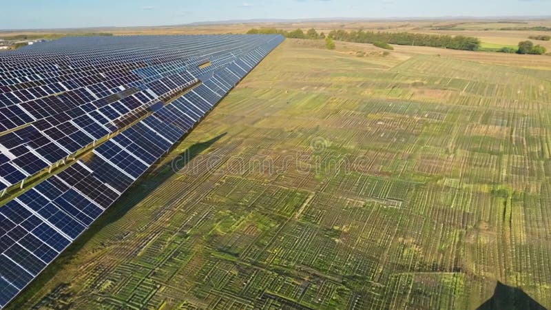 Aerial view of solar panels in a rural field royalty free illustration