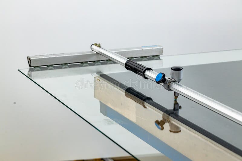 A Large Glass Sheet Lying on the Table in the Glass Factory and a