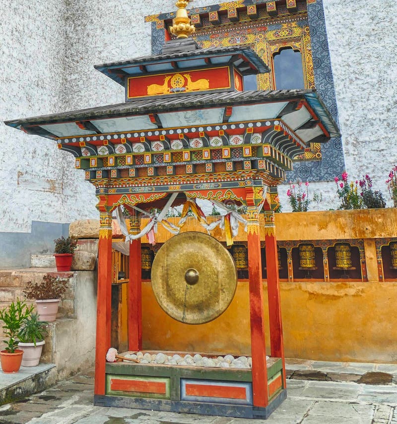 Large Gong and Prayer Wheels Outside Kenchosum Lhakhang Temple Stock ...