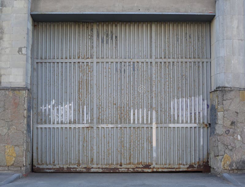 Large Gray Metal Gate in the Wall Stock Photo Image of metal, grey