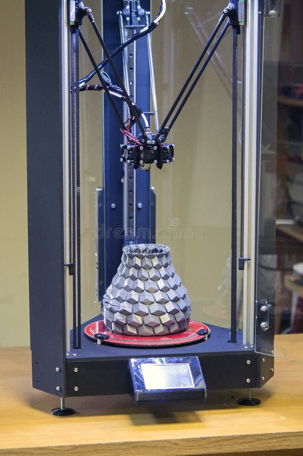 A large gray vase inside the 3d printer created by him royalty free stock photo