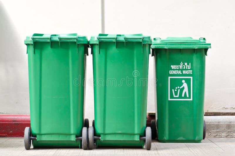 Large green trash cans stock photography