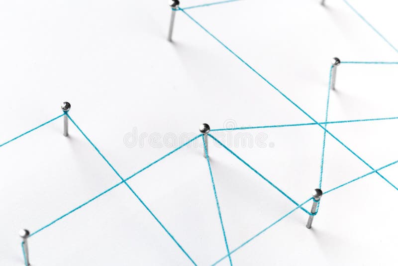 A large grid of pins connected with string. Communication, technology, network concept. Network with pins