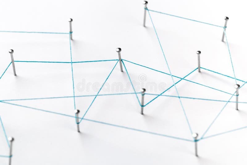 A large grid of pins connected with string. Communication, technology, network concept. Network with pins
