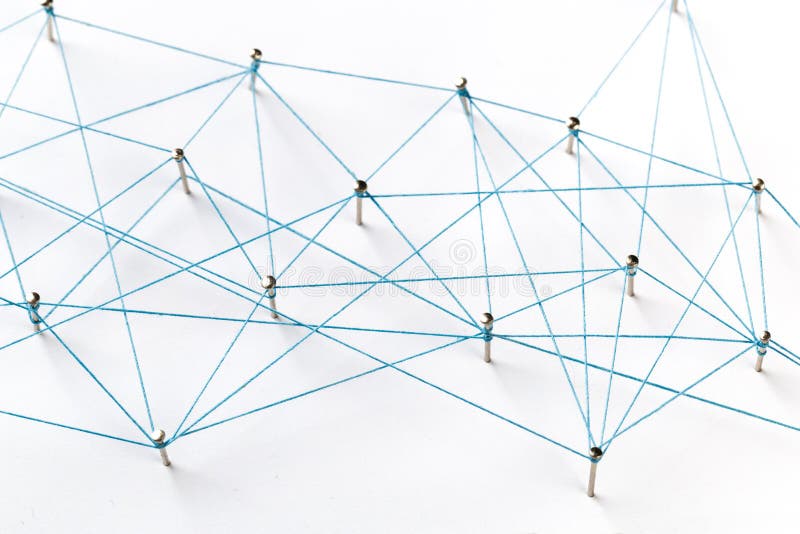 A large grid of pins connected with string. Communication, technology, network concept. Network with pinsA large grid of pins