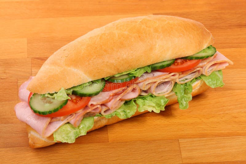 A large ham and tomato sandwich