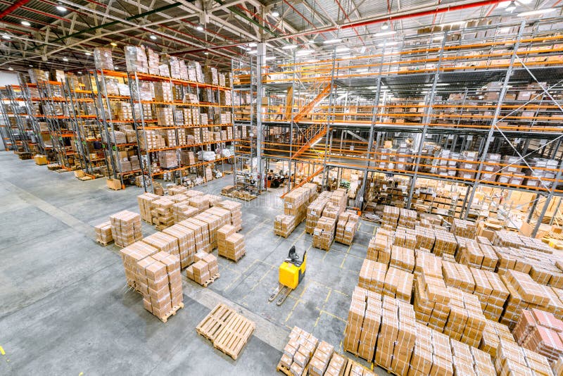 Large Industrial Warehouse. Many Cardboard Boxes Stand on a Loading