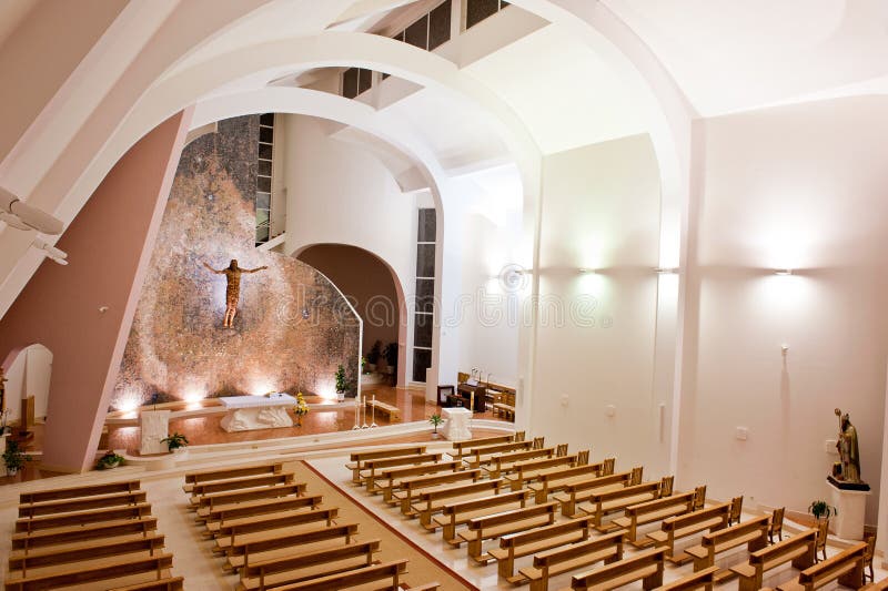 Interior shot of an large modern catholic church with high ceiling. Interior shot of an large modern catholic church with high ceiling.