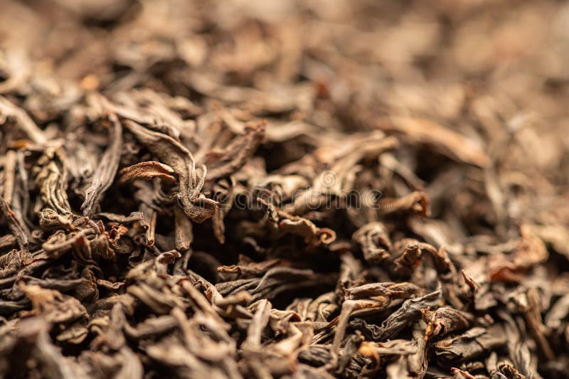 Largeleaved Black Tea in Bulk on the Table. Closeup of the Surface