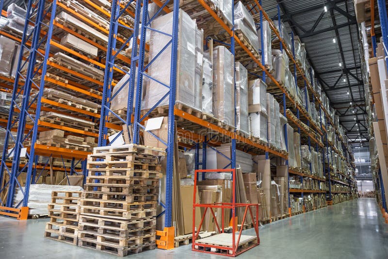 Large Logistics hangar warehouse with lots shelves or racks with pallets of goods. Industrial shipping and cargo delivery