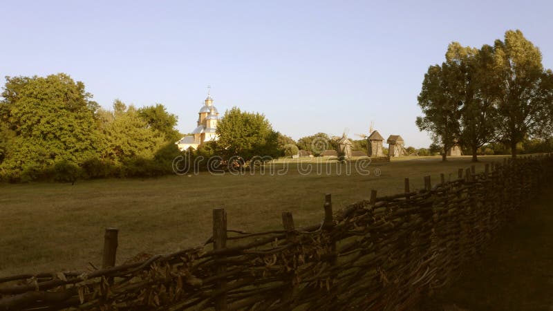 Large meadow is surrounded by wattle fence. stock photos Large meadow is surrounded by wattle fence. stock photos
