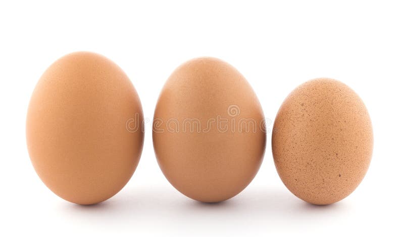 Large, medium and small chicken egg. stock photos Large, medium and small chicken egg. stock photos