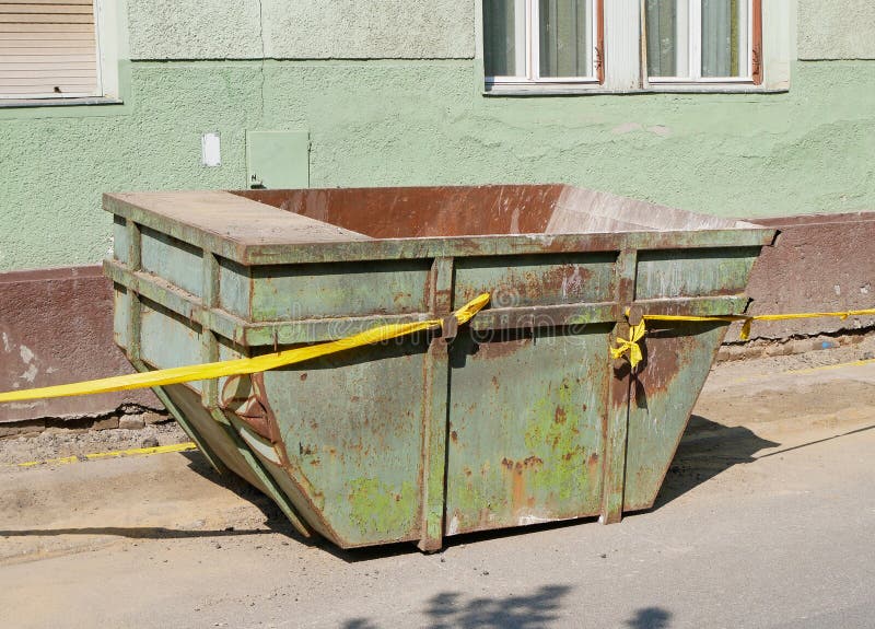 Large metal industrial garbage container on the street royalty free stock photos