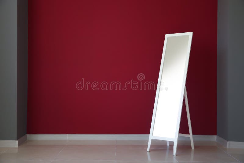 Large mirror near color wall