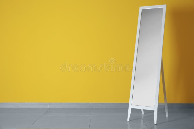 Large mirror near color wall