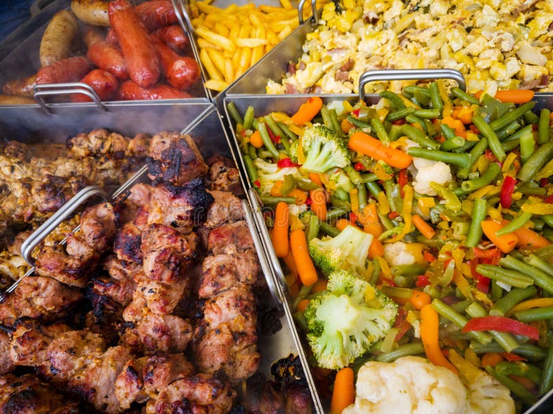 Large pan with variety of food at outdoor festival