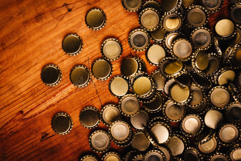 Large Pile of Beer Bottle Caps on Wooden Desk Stock Photo Image of