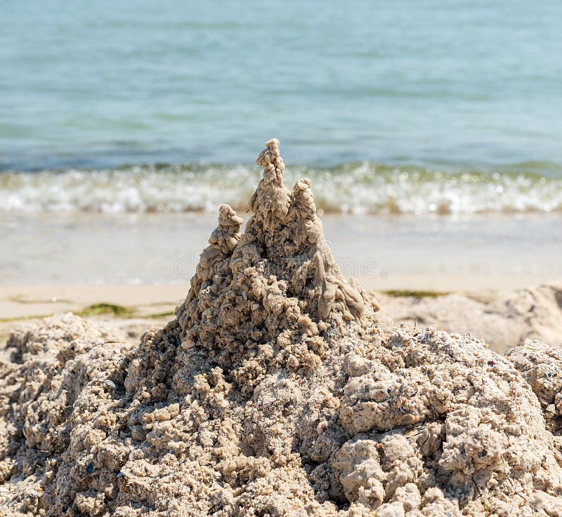 large-pile-wet-sand-beach-summer-day-136414572.jpg