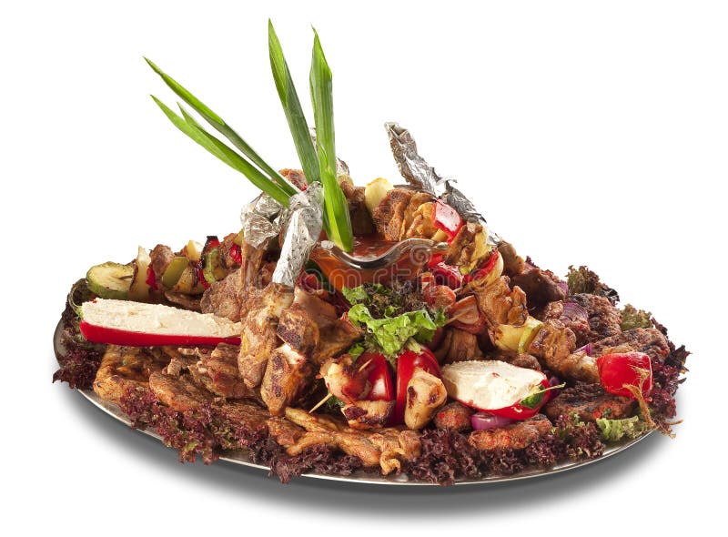 A large platter with plenty of meat and vegetables