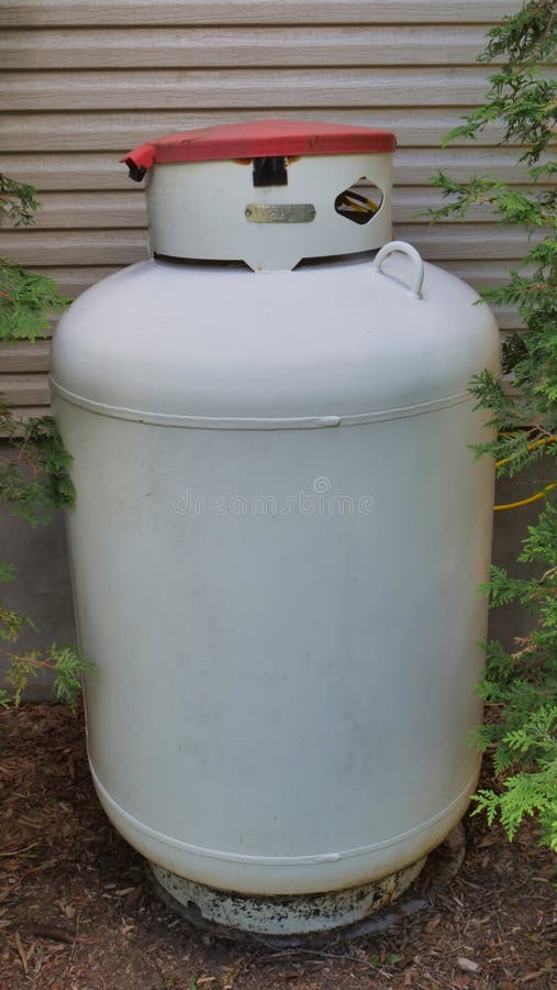 Large 400 Pound Propane Tank in the Yard of a Rural Home Stock Image