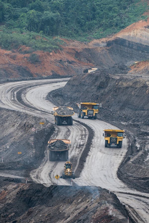 Loading coal into body truck. Mining truck mining machinery,to transport coal. Indonesia coal mining. stock images